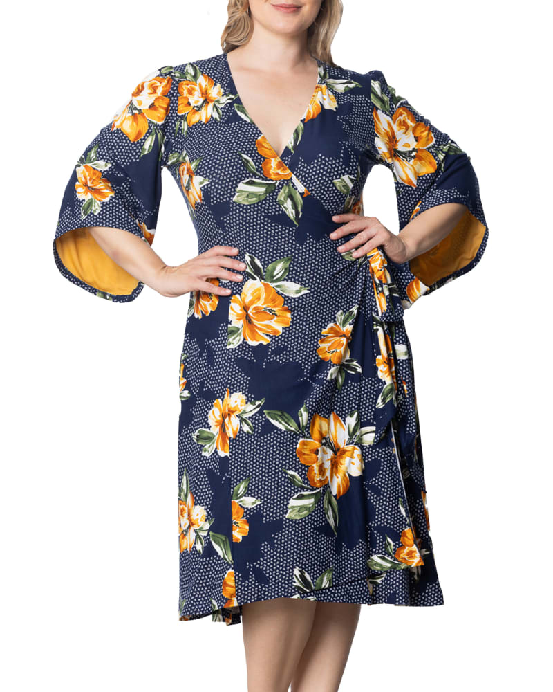 Front of a model wearing a size 0X Gemini Wrap Dress in AMBER BLOSSOMS by Kiyonna. | dia_product_style_image_id:353066